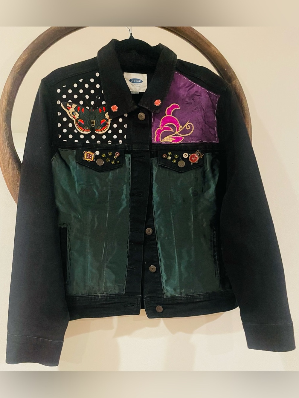 Old Navy Black Jacket with Green Panels and Purple Patch